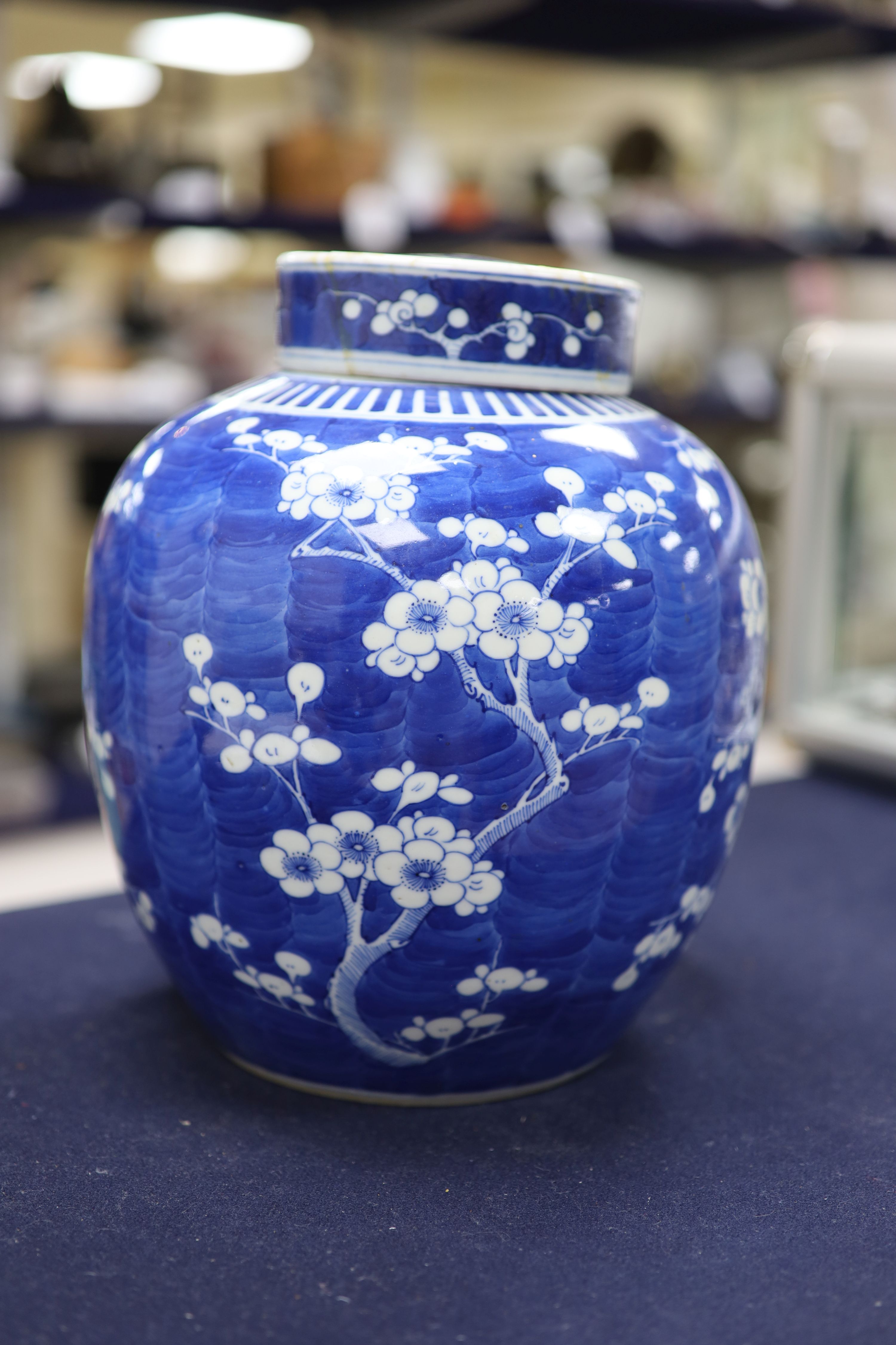 An early 20th century Chinese blue and white prunus jar and cover, height 26cm